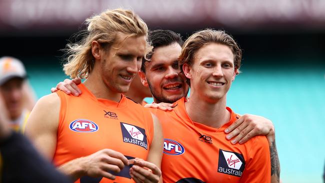 Lachie Whitfield, right, is a must-have as a defender in SuperCoach in 2019.