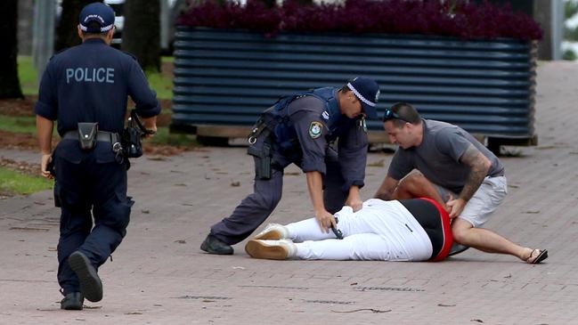A man is arrested by police after chasing him from the Rolling Loud Festival. Picture: Damian Shaw