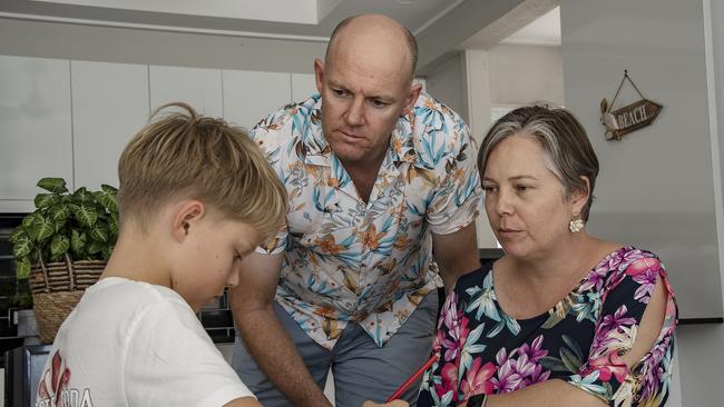 Dr Katie Williamson, 45, husband David, 47, and son Stevie, 10, at home in Cairns. Picture: Brian Cassey