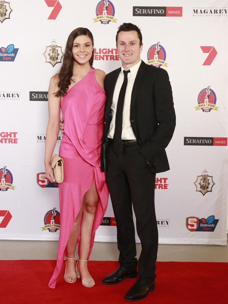 Sarah Dolan wearing One Fell Swoop, and Luke Habel pose for a picture on the red carpet at Adelaide Oval in North Adelaide, for the Magarey Medal, Monday, September 9, 2019. Picture: Matt Loxton