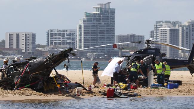 Emergency services at the helicopter crash site shortly after the collision. Picture: News Media Network