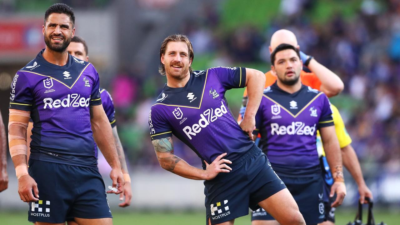 MELBOURNE, AUSTRALIA - MARCH 26: Jesse Bromwich, Cameron Munster and Brandon Smith of the Storm watch the big screen during the round three NRL match between the Melbourne Storm and the Parramatta Eels at AAMI Park, on March 26, 2022, in Melbourne, Australia. (Photo by Kelly Defina/Getty Images)