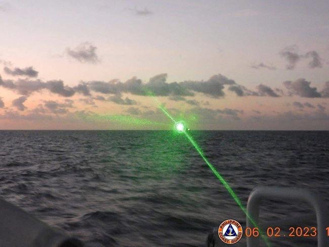 A Chinese Coast Guard vessel shining a "military grade laser light" at a Philippine Coast Guard boat. Picture: Supplied