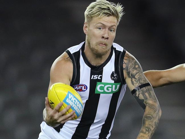 AFL Round 1. Western Bulldogs v Collingwood at Marvel Stadium..  21/03/2020.  Jordan De Goey of the Magpies clears infant of Marcus Bontempelli of the Bulldogs    . Pic: Michael Klein