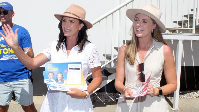 LNP candidate Bianca Stone (left) and Labor MP Meaghan Scanlon at a Nerang polling centre on Friday. Picture: Richard Gosling.