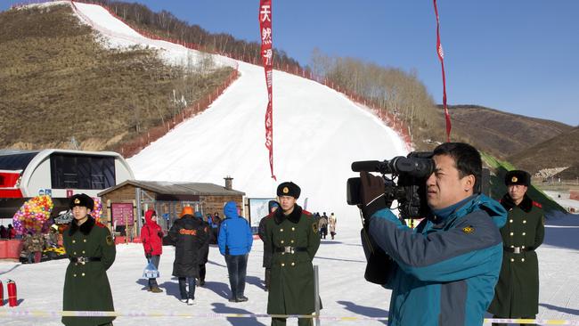 Not a flake of the real stuff in sight. At least the weather will be nice. AP Photo/Ng Han Guan