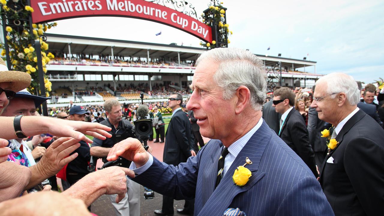 The former Prince Charles greets people during his visit to Flemington Racecourse in 2012.