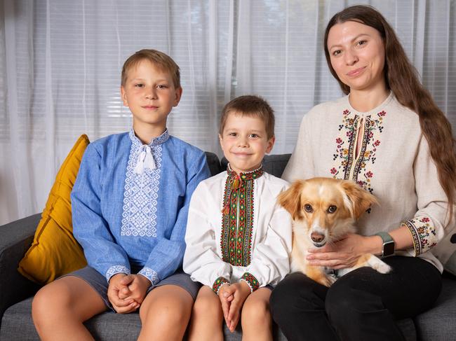 Ukranian Family, Vlad, 13 and Artur, 6 Sasha Masyuk, 34 with Laya (dog) inside their Heathpool SA home. Pictured on 21st Feb 2023. Picture: Ben Clark