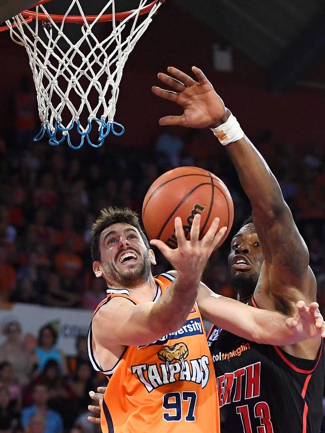 Jarrad Weeks of the Taipans is blocked by Derek Cooke Jr of the Wildcats during the round 12 NBL match between the Cairns Taipans and the Perth Wildcats at Cairns Convention Centre on December 31, 2017 in Cairns, Australia. (Photo by Ian Hitchcock/Getty Images)