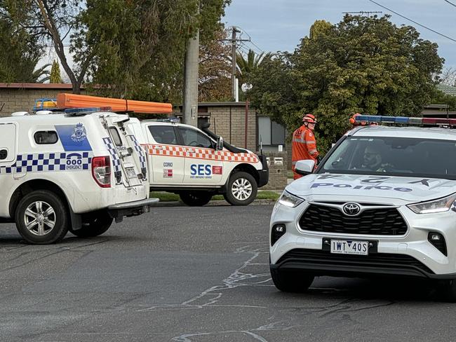 Police crowd a quiet Corio street on Monday afternoon following a crash. Photo: Alan Barber