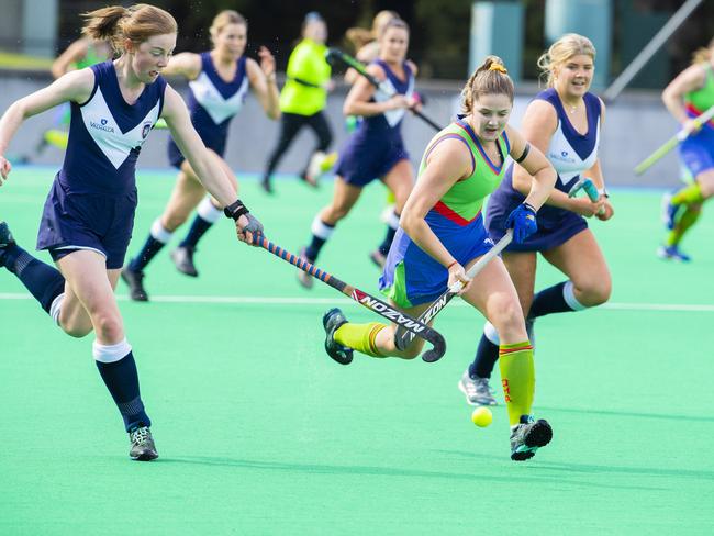 Julia Gunn runs the ball forward for OHA. Picture: Richard Jupe