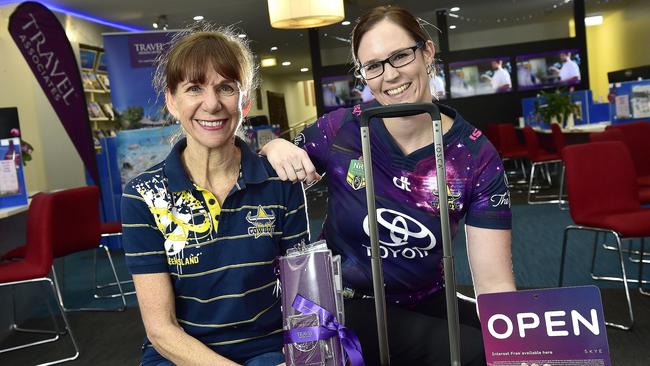 Townsville City Travel Associations are struggling after their shop has become a ghost town due to the coronavirus. Marketing manager Hannah Leith (PURPLE) and Townsville store manager Gail Barnes. PICTURE: MATT TAYLOR.