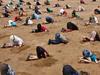 Photo taken The Strand beach in Townsville in response to lack of action on climate change. A couple of the people have been moved using photoshop. Photo: Cranky Curlew Productions.