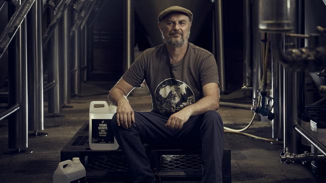 Young Henrys founder Richard Adamson in the brewery with sanitiser. Picture: Nick Cubbin