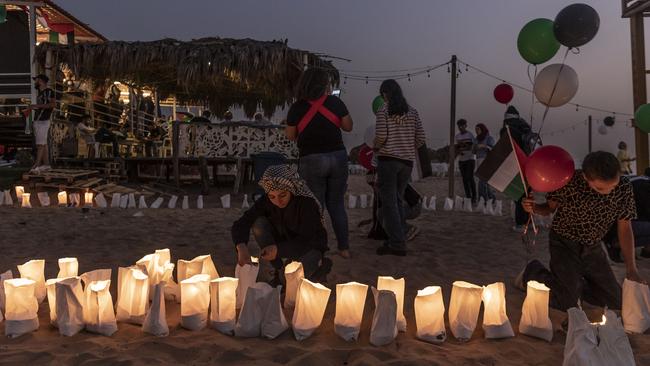 A Lebanese girl lights a candle during an event honouring Issam Abdallah, a Lebanese photojournalist killed by a missile strike by the IDF. Picture: Manu Brabo/Getty Images