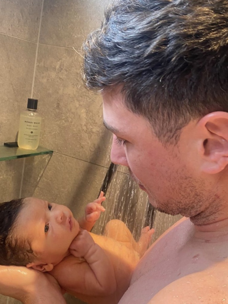 Mitchell Moses with his baby daughter Aspyn.