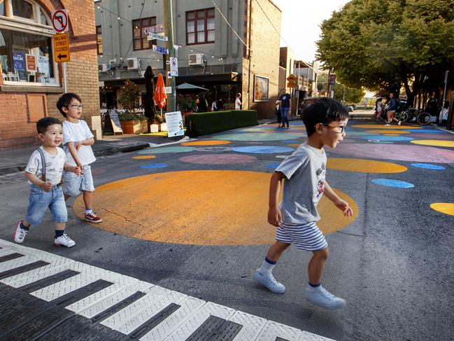 Harrison, Jackson and Xavier explore the coloured dots in Yarraville. Picture: David Geraghty