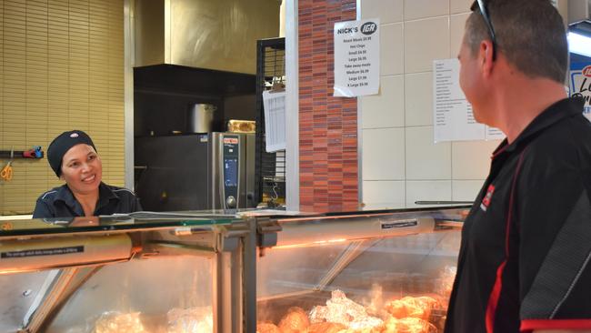 Perry's IGA deli manager Elena Williamson serving lunch to Stew Hughes. Picture: Heidi Petith