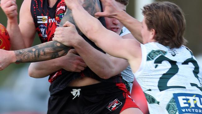 Echuca’s Matthew Lias tries to smother the ball. Picture Yuri Kouzmin