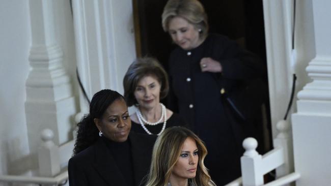 Former first ladies Hillary Clinton, Laura Bush, Michelle Obama and Melania Trump arrive for the service for Rosalynn Carter at Glenn Memorial Church in Atlanta on Tuesday. Picture: AFP