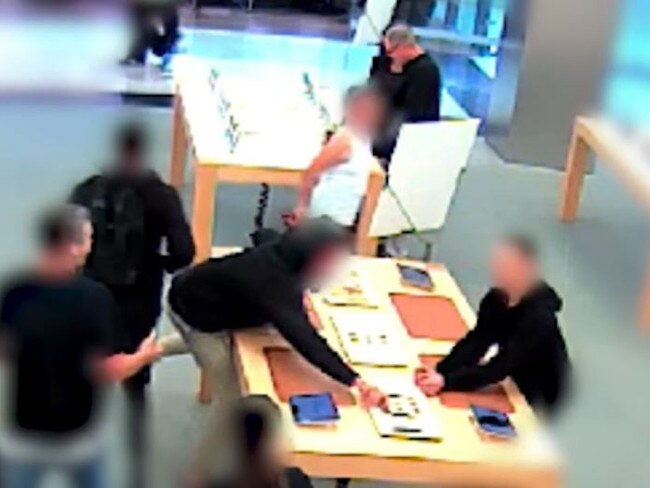 CCTV footage released by NSW Police show the three men flee when approached by store staff.