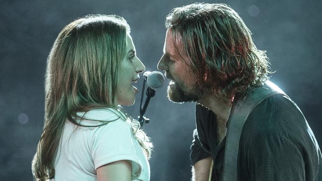 This image released by Warner Bros. Pictures shows Lady Gaga, left, and Bradley Cooper in a scene from "A Star is Born." (Clay Enos/Warner Bros. Pictures via AP)