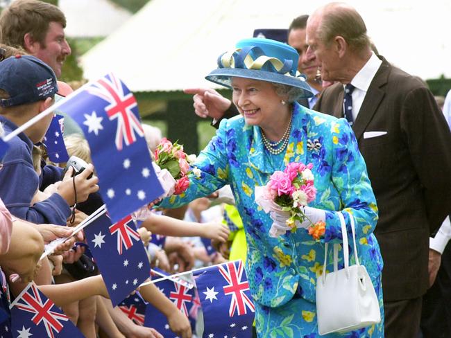 The Queen with the Duke of Edinburgh greets well-wishers in Central Park, Bourke, a small settlement north west of Sydney, on March 22, 2000. Picture: PA Images via Getty Images