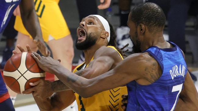 Patty Mills is fouled by Kevin Durant in the Boomers’ win over Team USA