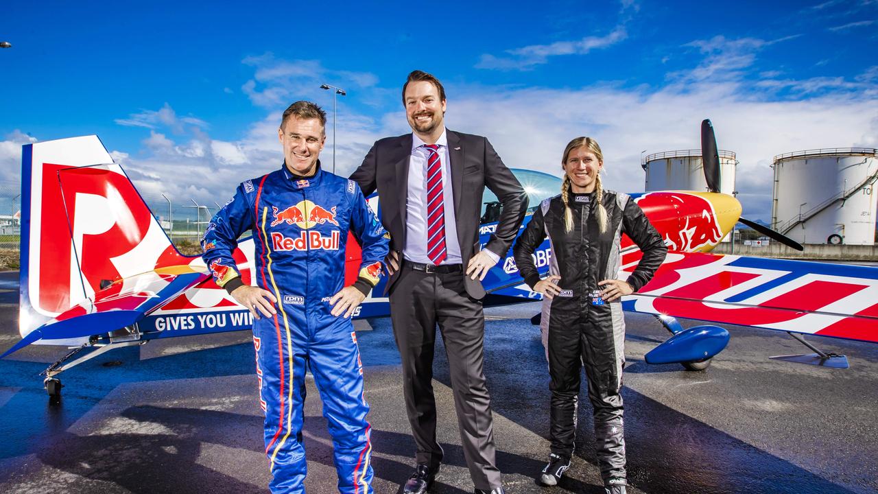 One of the world's biggest airshows is coming back to the Gold Coast. Aerobatic pilot's Matt Hall and Emma McDonald with Pacific Airshow director Kevin Elliott. Picture: NIGEL HALLETT