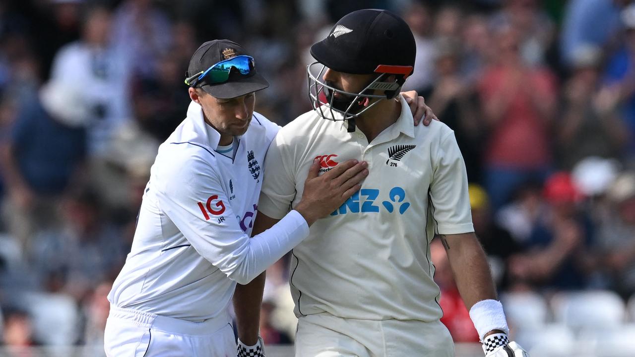 Joe Root congratulates Daryl Mitchell for his stunning innings. (Photo by Paul ELLIS / AFP)