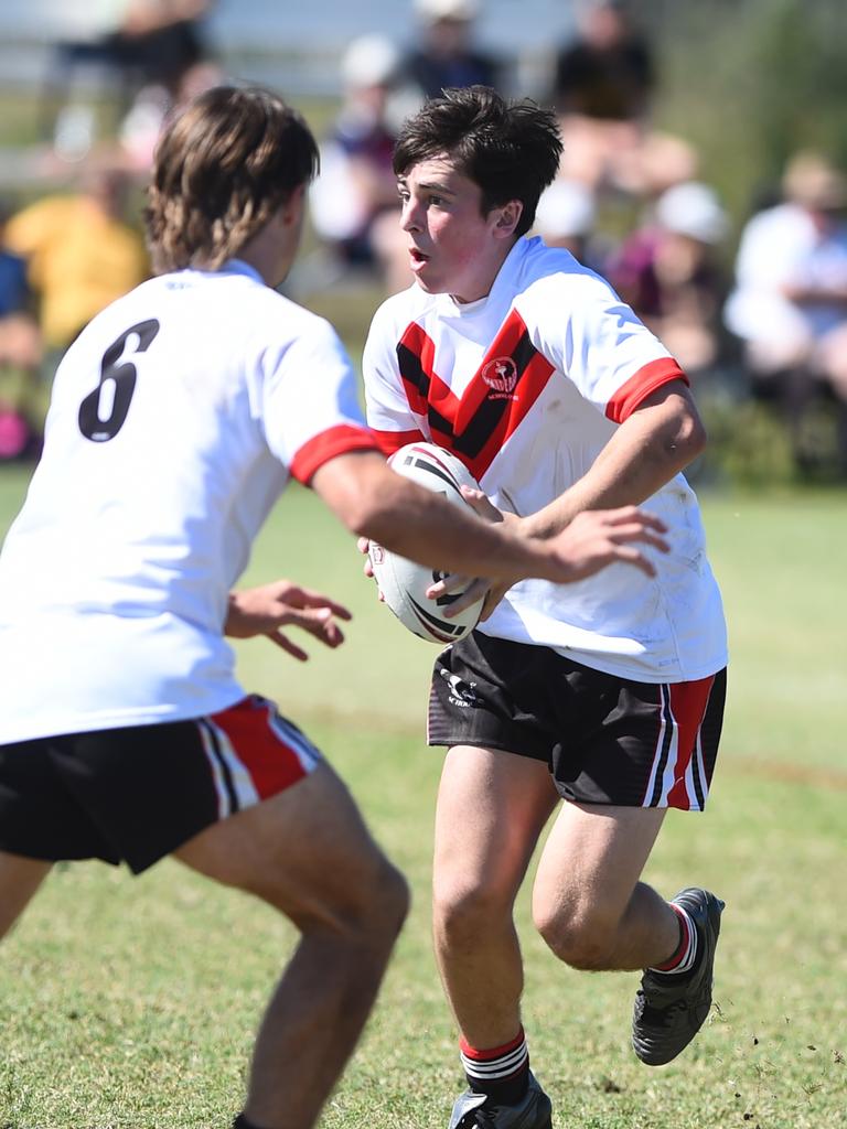 Boys Rugby League State Championship held at Northern Division, Brothers Leagues ground, Townsville. South West (black) v Wide Bay (white). 16-18 years. Ezekiel Monckton of Shalom College.