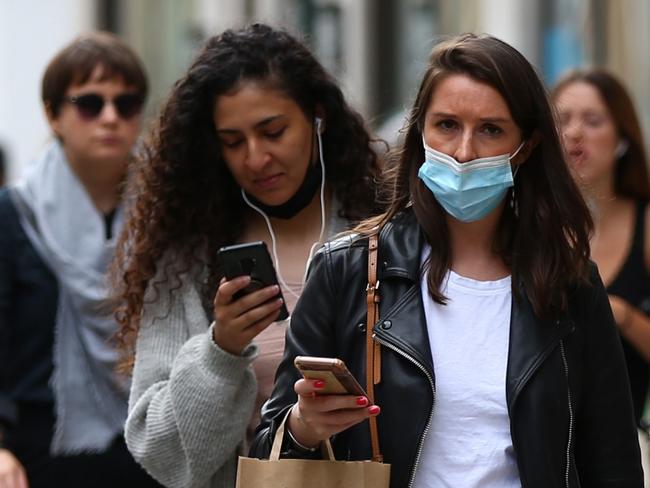 LONDON, ENGLAND - JULY 04: People wear face masks while shopping at Covent Garden on July 4, 2021 in London, England. Robert Jenrick, British minister for housing communities and local government, said in a TV interview on Sunday that compulsory mask wearing would soon end and become a matter of personal responsibility. Most or all social restrictions related to Covid-19 are anticipated to end in England on July 19. (Photo by Hollie Adams/Getty Images)