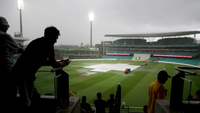 Heavy rain falls on the first Day of the Sydney Test Match against Australia and the West Indies at the SCG.