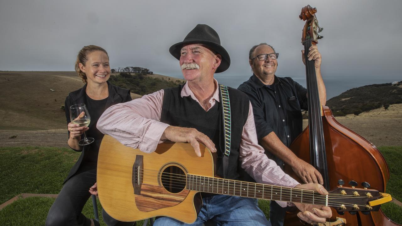 Ob Guard guitarist Angus Guild and bassist Richard Cotterill with Tam Bailey from Dudley Wines getting ready for the Kangaroo Island Cup. Picture: Simon Cross