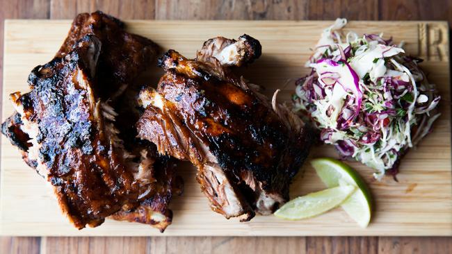 Sticky pork ribs with green paw paw slaw.