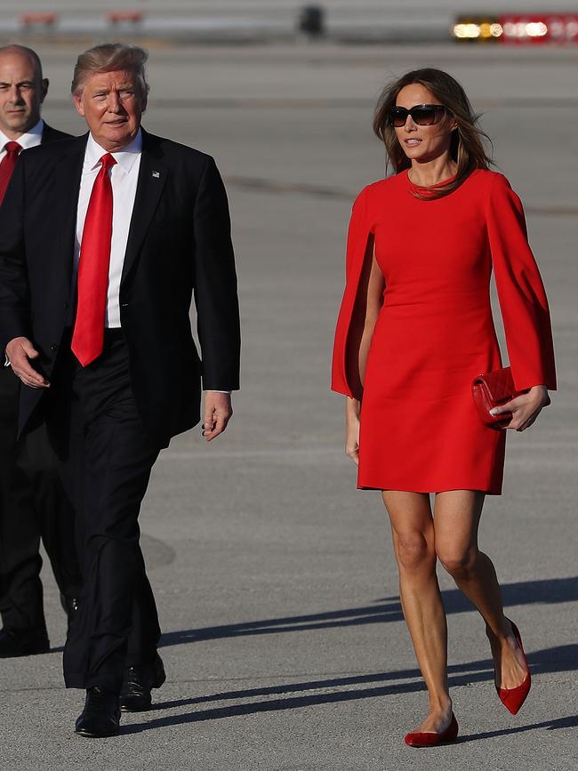 FEBRUARY 3: Melania showed off her legs in a short red Givenchy dress as she and her husband crossed the tarmac at Palm Beach International Airport for a visit to his Mar-a-Lago Resort. Picture: Getty