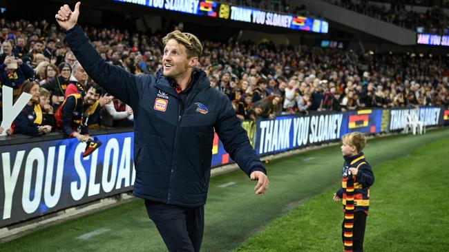 Rory Sloane thanks fans as he walks a lap after announcing his retirement in 2024.