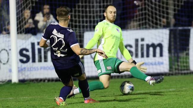 Stefan Valentini slots the ball past the Port Melbourne goalkeeper. Picture: Oakleigh Cannons FC