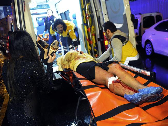 Medics carry a wounded person at the scene after an attack at a popular nightclub in Istanbul. Picture: AP