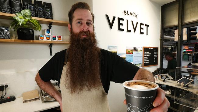 Black Velvet barista Tom Glen makes an almond milk latte. Picture: Ian Currie