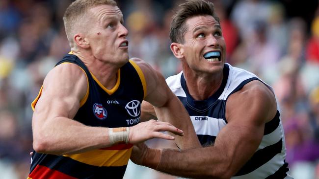 Reilly O'Brien of the Crows competes with Cats forward Tom Hawkins. Picture: James Elsby/AFL Photos via Getty Images