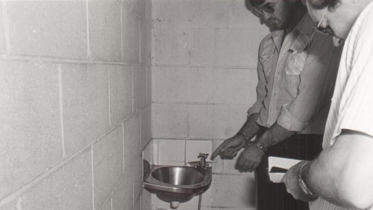 Reid shows Ian Spiers where he washed off blood in the male toilets at Tweed Heads after the murder.