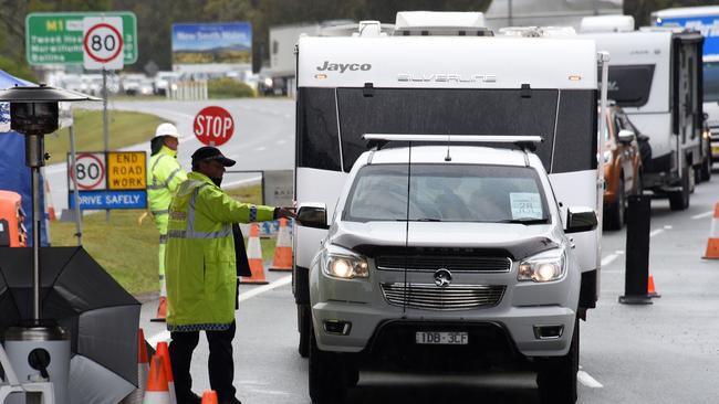 Police check cars at the Queensland border with NSW at Stuart Street at Coolangatta on Friday. Picture: Steve Holland/NCA NewsWire