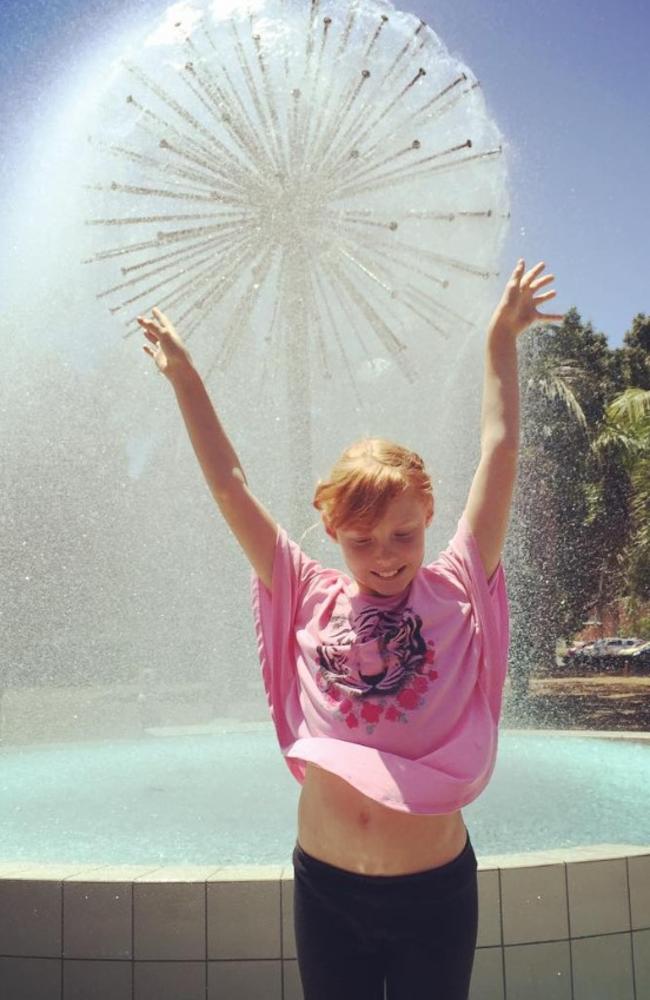 Chloe Waddell in front of the Mackay thistle fountain in-between Gordon St and Alfred St. Picture: Heidi Petith