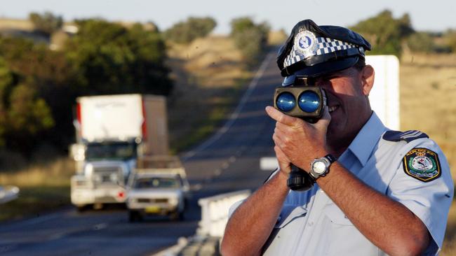 A Goulburn highway patrol officer conducting speed checks on the Hume Highway, near Goulburn. Picture: Angelo Soulas.