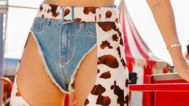 The website shows the shorts paired with cow-print chaps. Picture: Pretty Little Thing