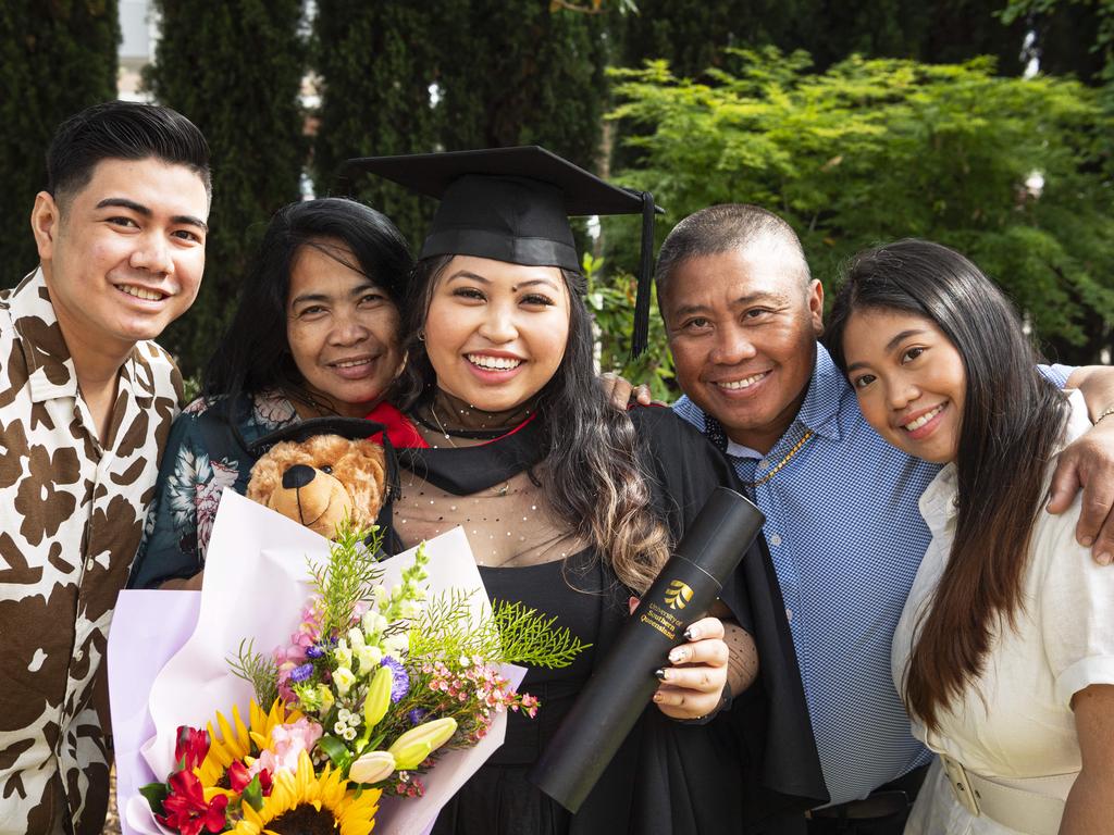 Bachelor of Information Technology graduation Kristine Silang with (from left) Coddy Ramchand, Marsha Silang, Wilmer Silang and Keycee Santias at a UniSQ graduation ceremony at The Empire, Wednesday, October 30, 2024. Picture: Kevin Farmer