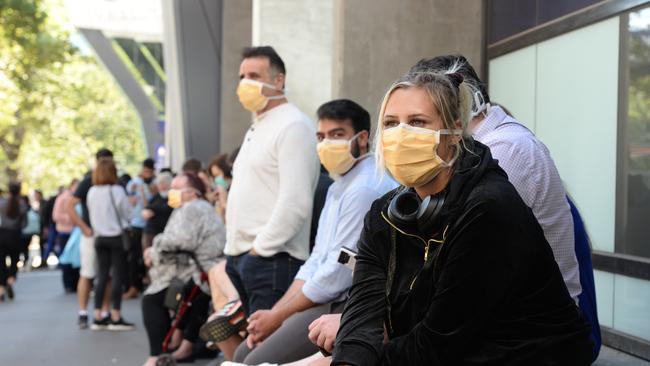 Izzy from West Footscray has queued outside the Royal Melbourne Hospital for more than two hours waiting to be be tested. Picture: Andrew Henshaw