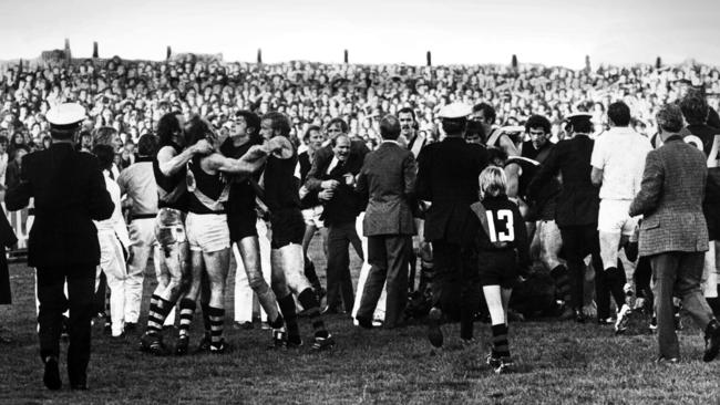 Officials and fans join players in the infamous 1974 Windy Hill brawl.