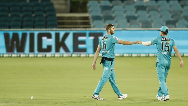 Brisbane Heat bowler Mark Steketee (left) celebrates the wicket of the Renegades’ Jake Fraser-McGurk with teammate Joe Burns. Picture: Darrian Traynor/Getty Images